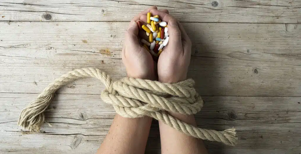 Illustration of the social consequences of addiction on individuals, families, and communities.