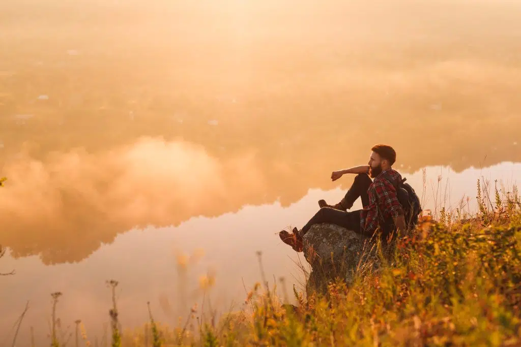 Individual reflecting on their journey, symbolizing the challenges and strategies involved in navigating relapse.