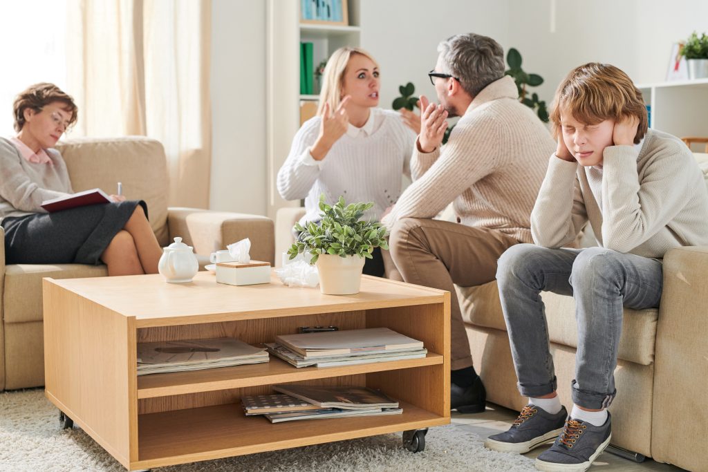 Family members discussing the effects of living with an addict, highlighting emotional and psychological impacts.