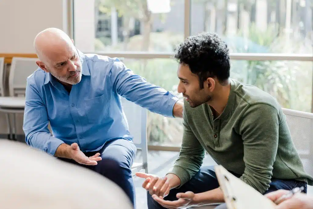 Illustration of exposure therapy, showing a therapist guiding a client through gradual exposure to anxiety-inducing situations in a controlled environment.