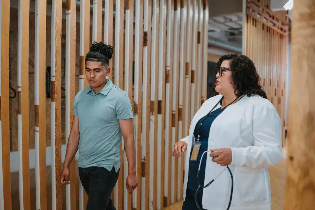 A medical professional guiding a patient through the detoxification process