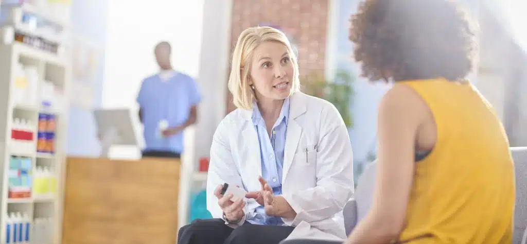 A healthcare professional discussing medication-assisted treatment options with a patient"