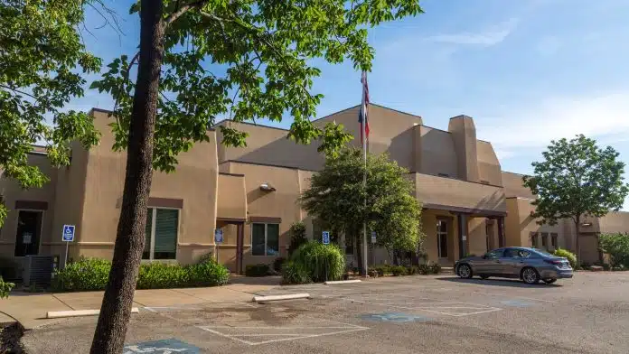 Exterior view of The Meadows Texas facility in Princeton, TX, specializing in addiction treatment services.