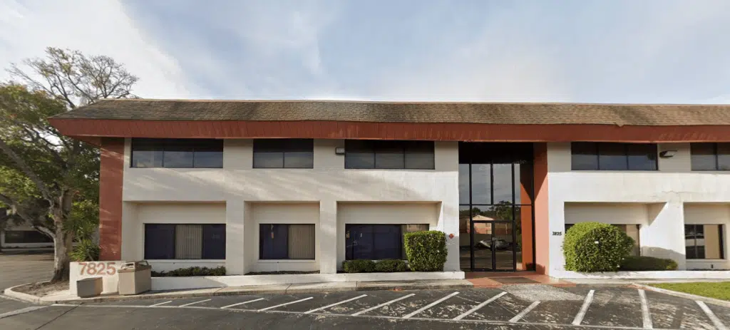 Exterior view of Associates in Behavioral Health and Recovery in Tampa Florida showing clinic entrance and signage