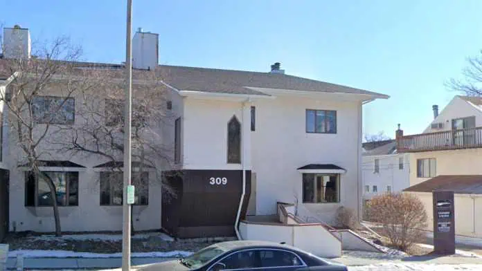 Front entrance of Chambers & Blohm Psychiatric Services building in Bismarck, North Dakota, showing the clinic’s glass-entry and signage