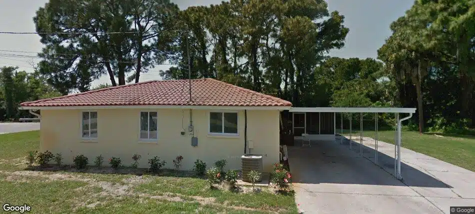 Single-story sober living home surrounded by trees at Da Vinci Recovery Homes, 6107 Springer Dr, Port Richey, FL 34668