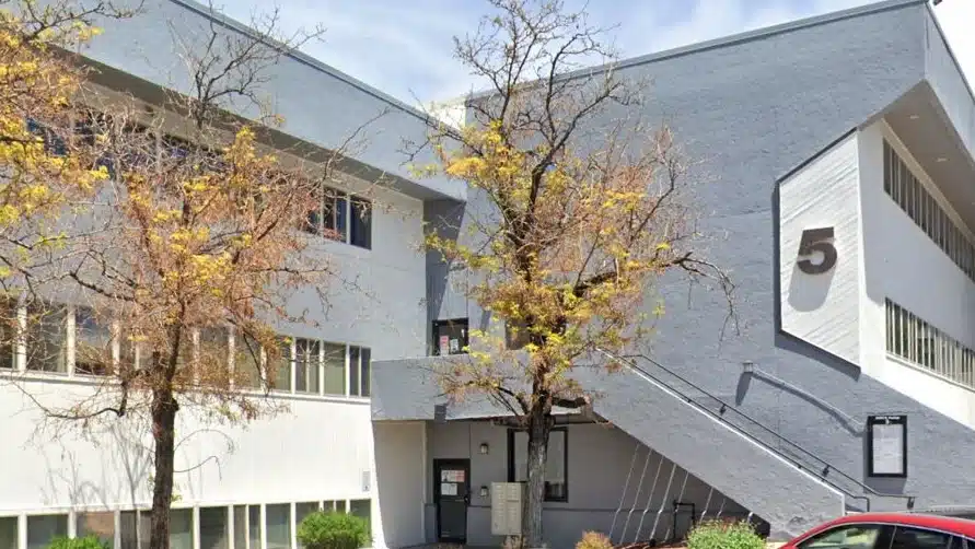 Front entrance of National Institute for Change building in Aurora, Colorado, showing clinic entryway and signage