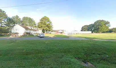 Main entrance of Freedom House residential addiction recovery center for women in Rogersville, Alabama
