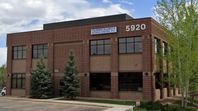 Front entrance of Gallus Detox Center in Littleton, Colorado, showing accessible pathways and signage