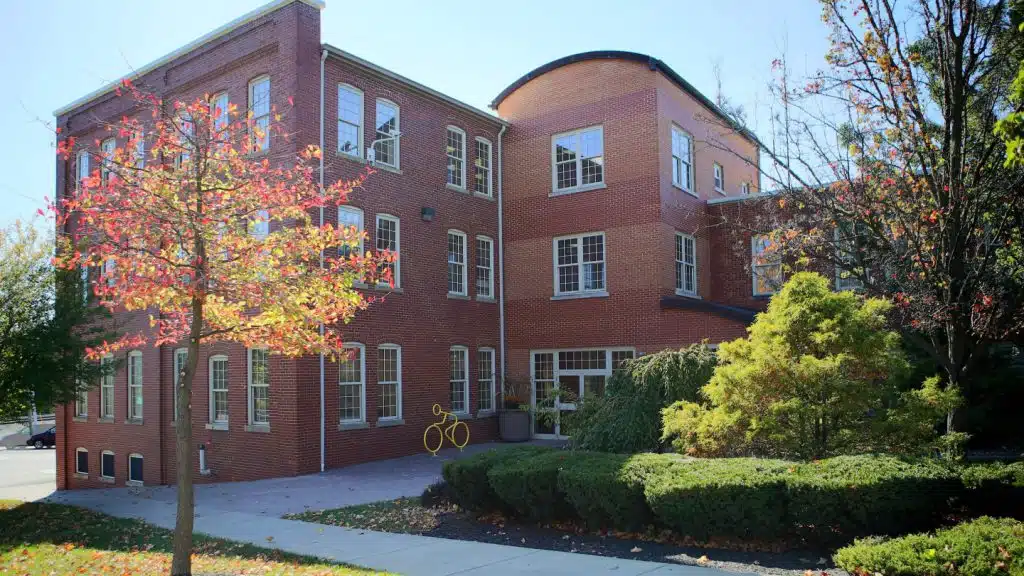 Exterior view of OneEighty Downtown in Wooster, Ohio, showing the building entrance and main facade.