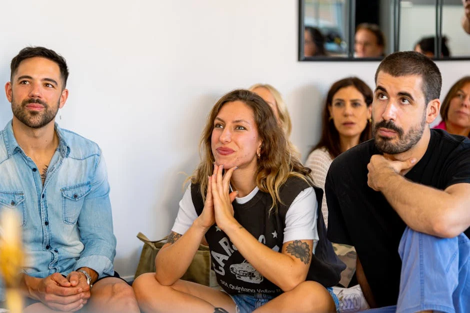 A diverse group of people engaged in a supportive group meeting, listening attentively - Drug Rehabilitation Services in USA