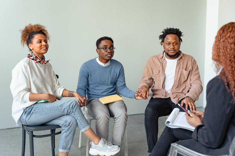A diverse group of people engaged in a supportive group therapy session, symbolizing community and shared recovery - Crack Detox