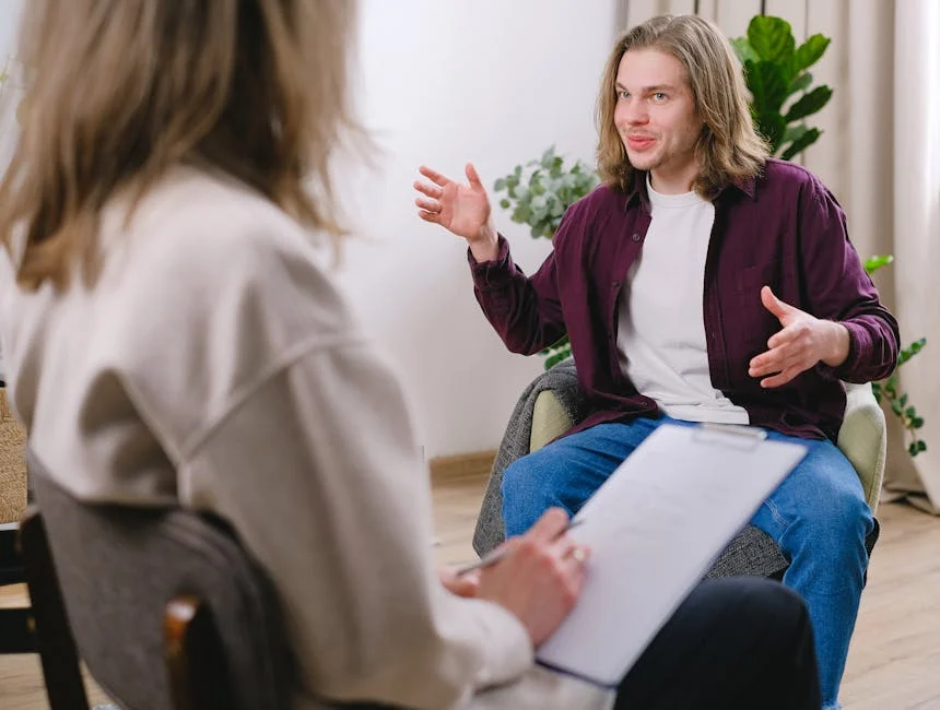 therapist and patient engaged in a one-on-one therapy session - Anxiety Disorder Treatment Centers