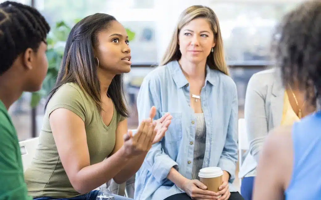 Group therapy session in a bright, modern room - san antonio alcohol treatment centers Group therapy session in a bright, modern room - san antonio alcohol treatment centers