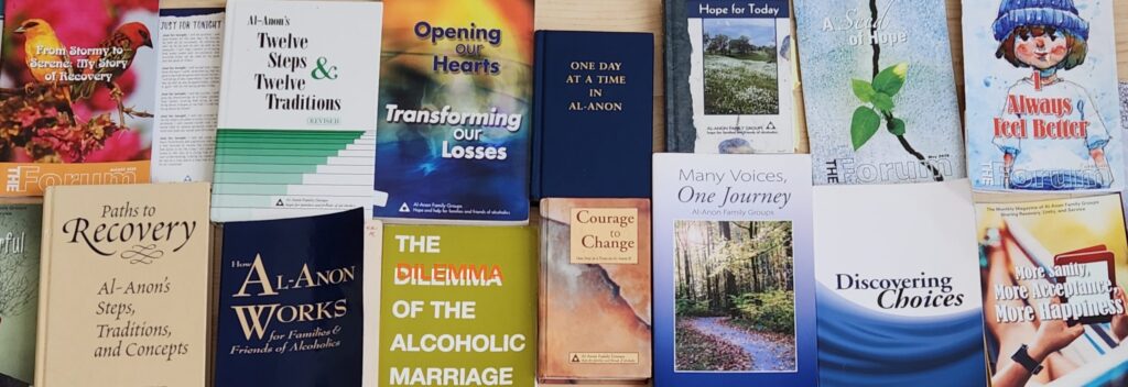 A collection of Al-Anon Conference Approved Literature (CAL), including books, pamphlets, and the 'Al-Anon Faces Alcoholism' magazine, arranged neatly on a table - al anon family groups