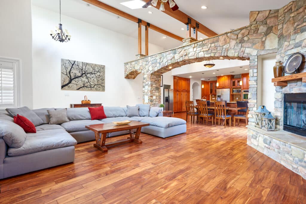 A comfortable, luxurious living area inside Gratitude Lodge with plush sofas and warm lighting - Gratitude Lodge