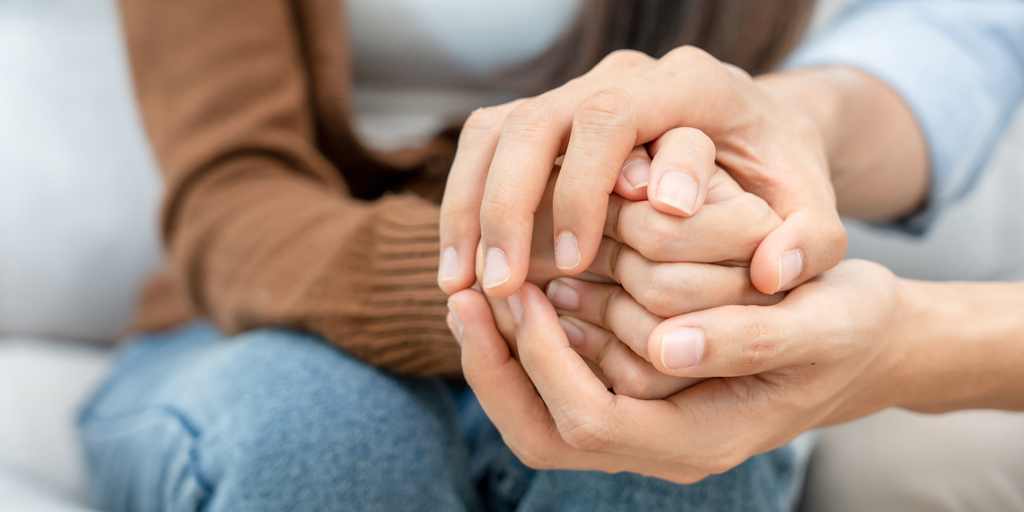 A person offering a comforting hand to a friend - drug withdrawal A person offering a comforting hand to a friend - drug withdrawal