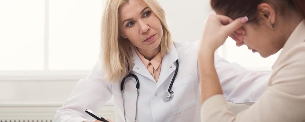 A compassionate doctor talking to a patient - drug withdrawal A compassionate doctor talking to a patient - drug withdrawal