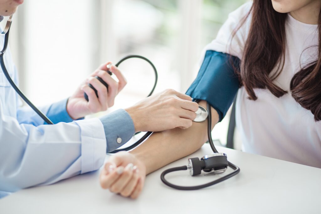 Image of a compassionate nurse checking a patient's vitals in a calm, clinical setting. - What should I expect during the detox process?