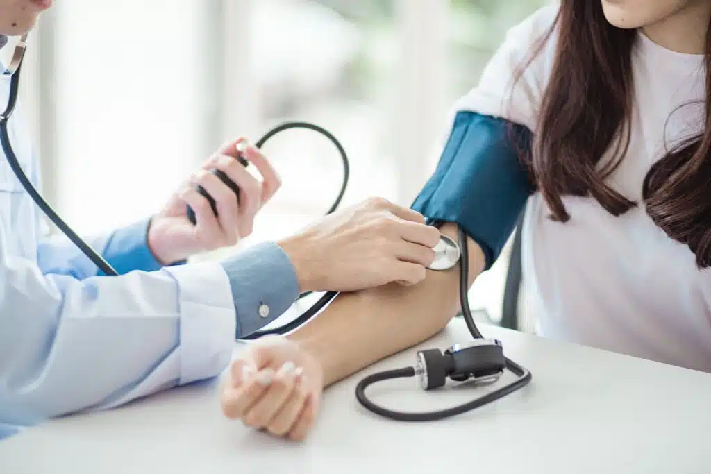Image of a compassionate nurse checking a patient's vitals in a calm, clinical setting. - What should I expect during the detox process? Image of a compassionate nurse checking a patient's vitals in a calm, clinical setting. - What should I expect during the detox process?