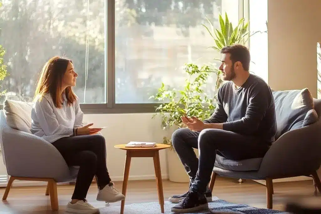 A compassionate therapist listens attentively to a patient during a one-on-one therapy session - alcohol detox treatment centers A compassionate therapist listens attentively to a patient during a one-on-one therapy session - alcohol detox treatment centers