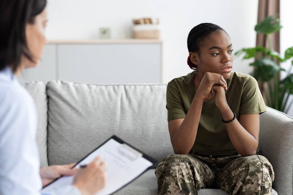 Compassionate therapist talking with a patient - PTSD treatment centers Compassionate therapist talking with a patient - PTSD treatment centers