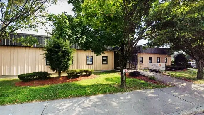Entrance of Community Care Alliance on John Cummings Way in Woonsocket, Rhode Island providing addiction and behavioral health care
