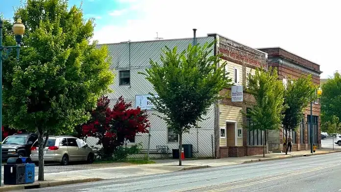 Main entrance of Western Carolina Rescue Ministries in Asheville, North Carolina, showing the building offering addiction recovery and support services.