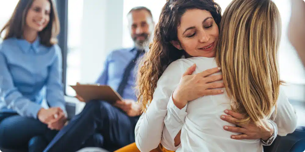 family attending a group therapy session - Mental health intervention