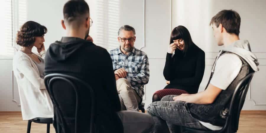 group therapy session in a comfortable, supportive setting - how do residential and outpatient rehab programs compare group therapy session in a comfortable, supportive setting - how do residential and outpatient rehab programs compare