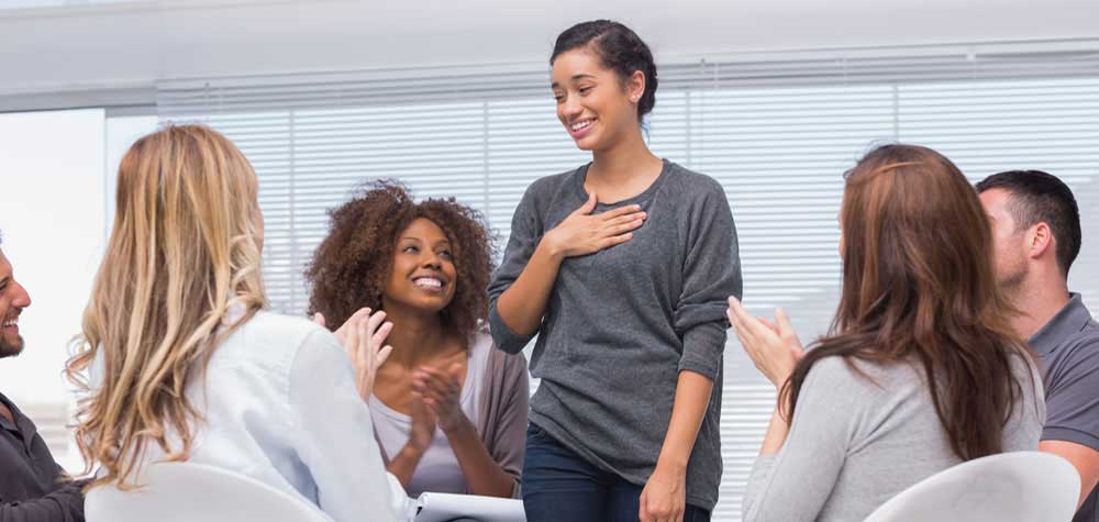A diverse group of individuals engaging in a supportive group therapy session, with a therapist guiding the discussion - alcohol detox treatment centers A diverse group of individuals engaging in a supportive group therapy session, with a therapist guiding the discussion - alcohol detox treatment centers