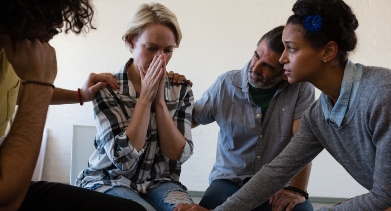 A group therapy session with diverse individuals engaged in discussion, showing support and shared learning. - relapse prevention program A group therapy session with diverse individuals engaged in discussion, showing support and shared learning. - relapse prevention program