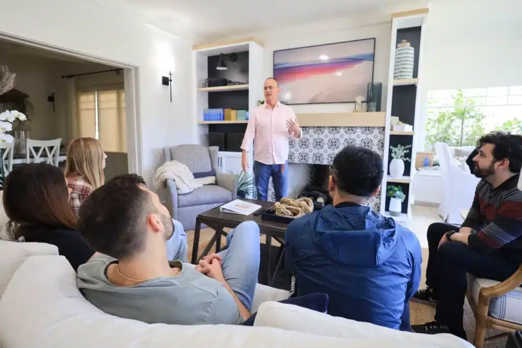 A group therapy session in a comfortable setting with natural light - Gratitude Lodge