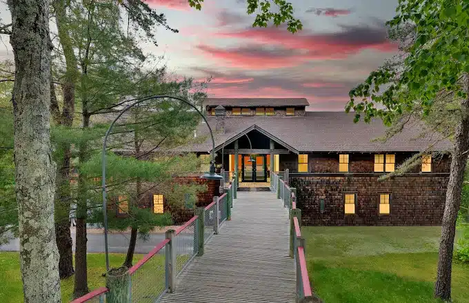 Main building of Spring Hill Recovery Center with lush greenery - Spring Hill Recovery Main building of Spring Hill Recovery Center with lush greenery - Spring Hill Recovery