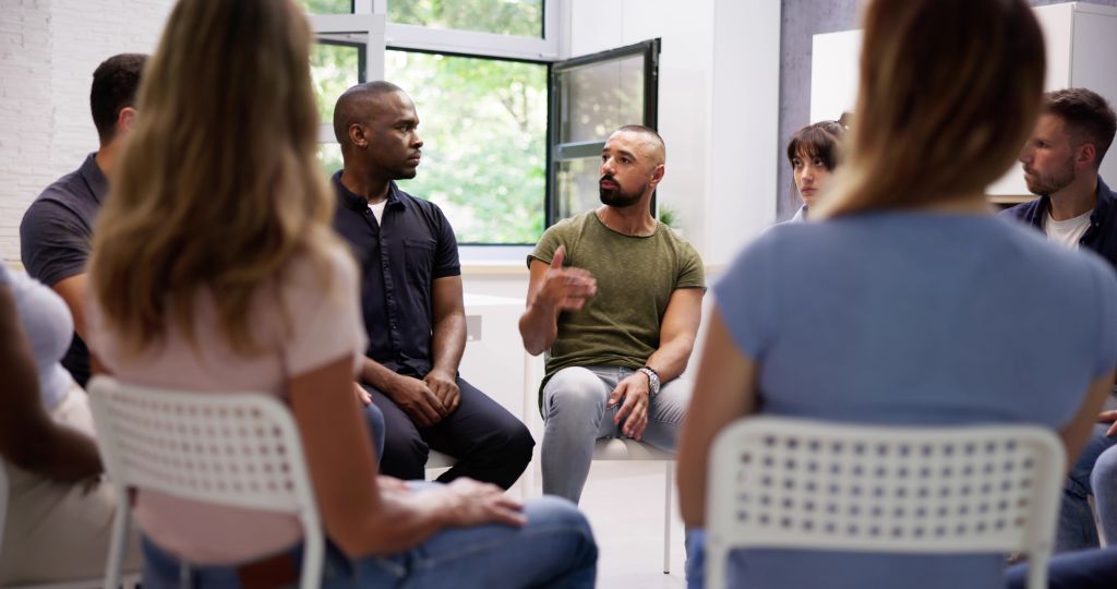 person talking one-on-one with a compassionate counselor - how do residential and outpatient rehab programs compare person talking one-on-one with a compassionate counselor - how do residential and outpatient rehab programs compare