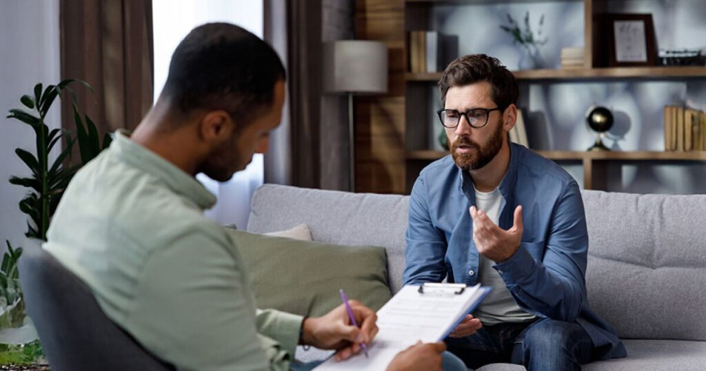 A one-on-one counseling session in a private, calm office - Alliance Recovery