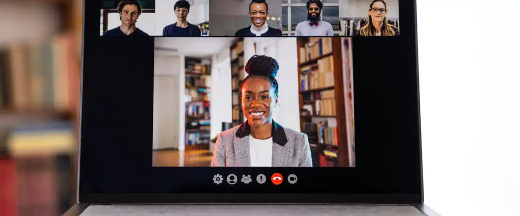 Person attending an online Al-Anon meeting on a laptop, with other participants visible in video chat windows - al anon family groups Person attending an online Al-Anon meeting on a laptop, with other participants visible in video chat windows - al anon family groups