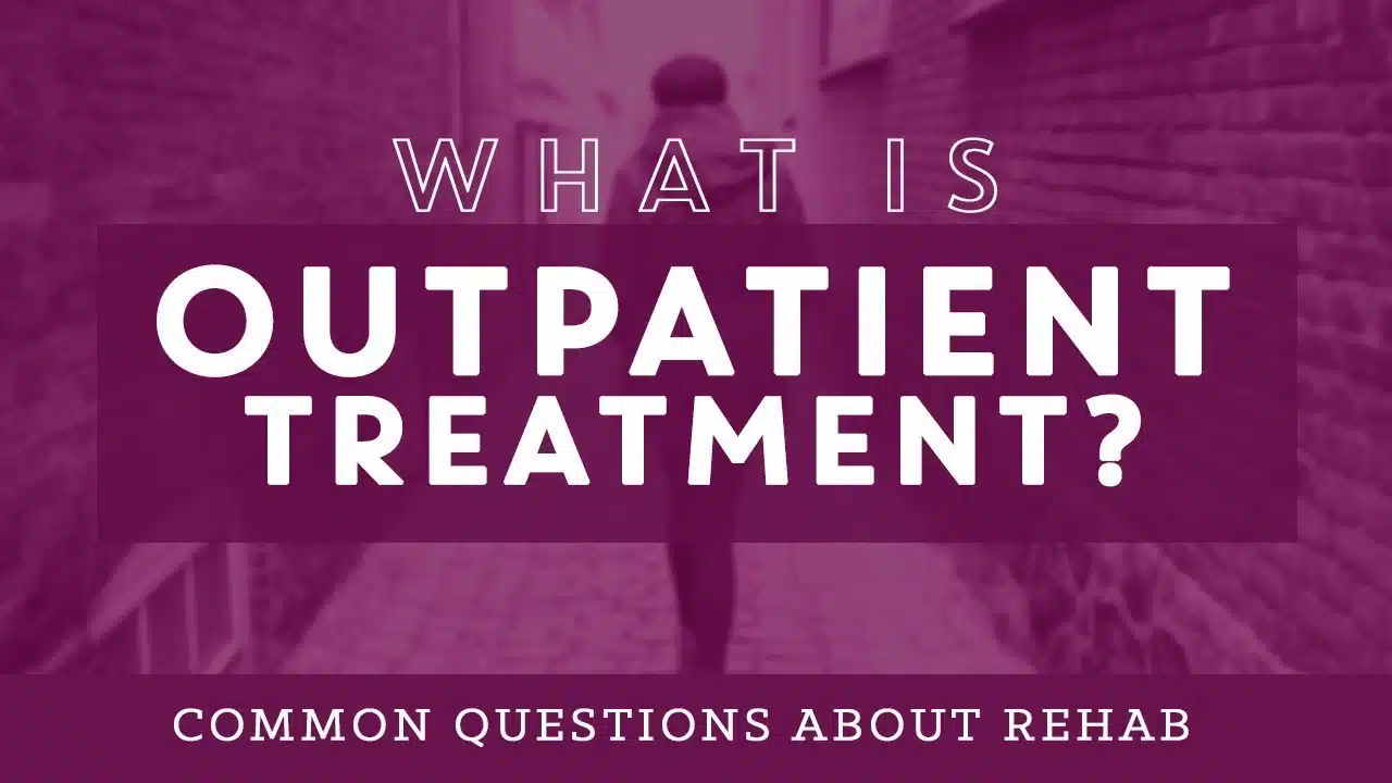 Person reviewing an outpatient drug treatment guide for addiction recovery