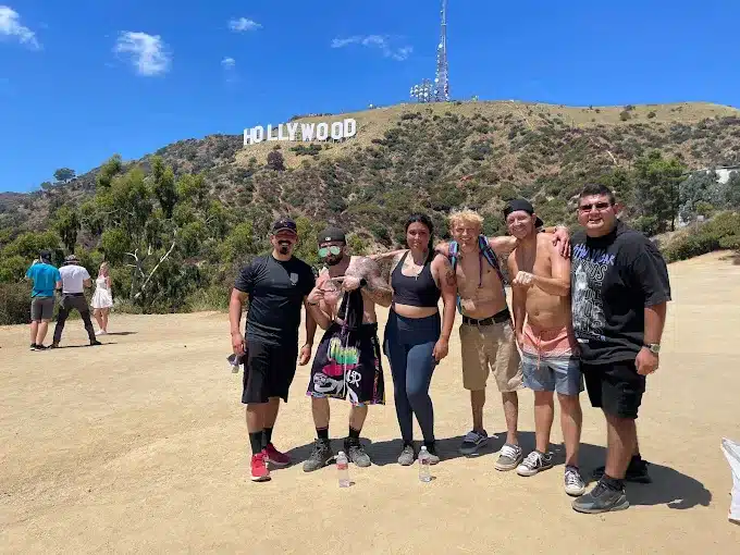 A group participating in a peaceful outdoor yoga or meditation session - Alliance Recovery