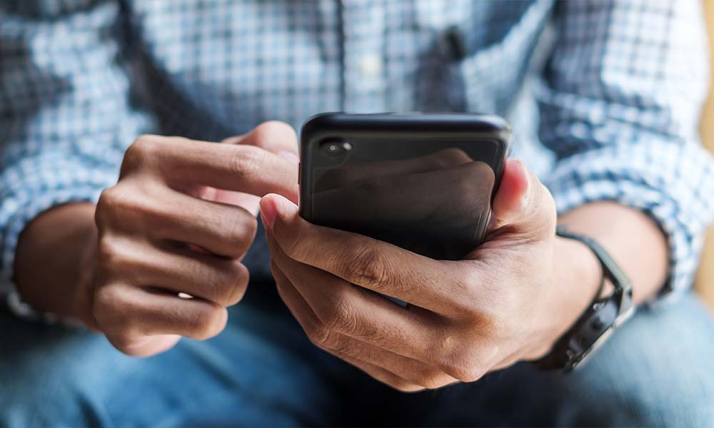 Image of a person on the phone, looking determined and hopeful, representing the act of seeking help - Temecula drug rehab Image of a person on the phone, looking determined and hopeful, representing the act of seeking help - Temecula drug rehab