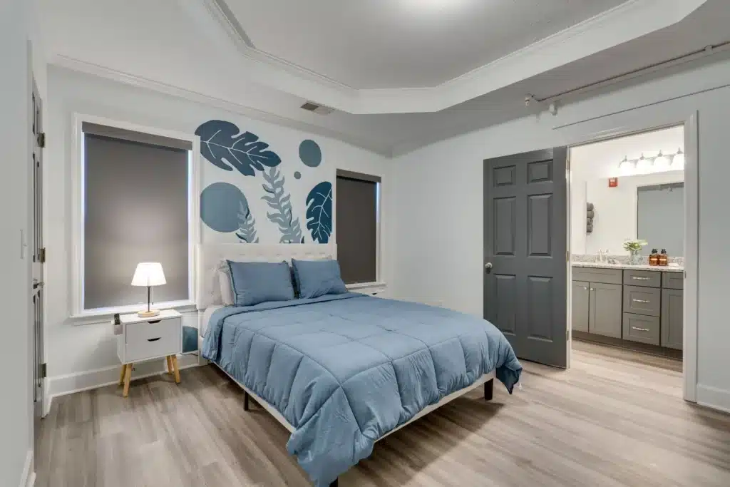 A serene and clean room in a residential detox facility, with a comfortable bed and natural light - alcohol detox treatment centers near me