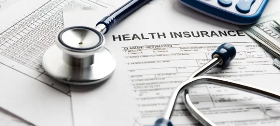 Person on the phone, looking relieved, representing sorting out insurance - what is alcohol rehab