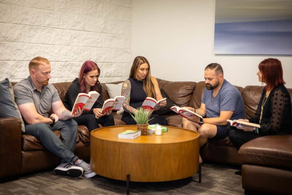 A support group meeting in a circle, diverse group sharing and listening - Christian rehab California A support group meeting in a circle, diverse group sharing and listening - Christian rehab California