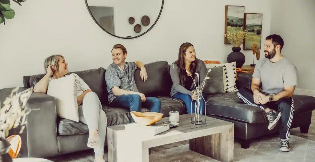 A supportive family in a comfortable home setting, laughing together. - detox centers near me A supportive family in a comfortable home setting, laughing together. - detox centers near me