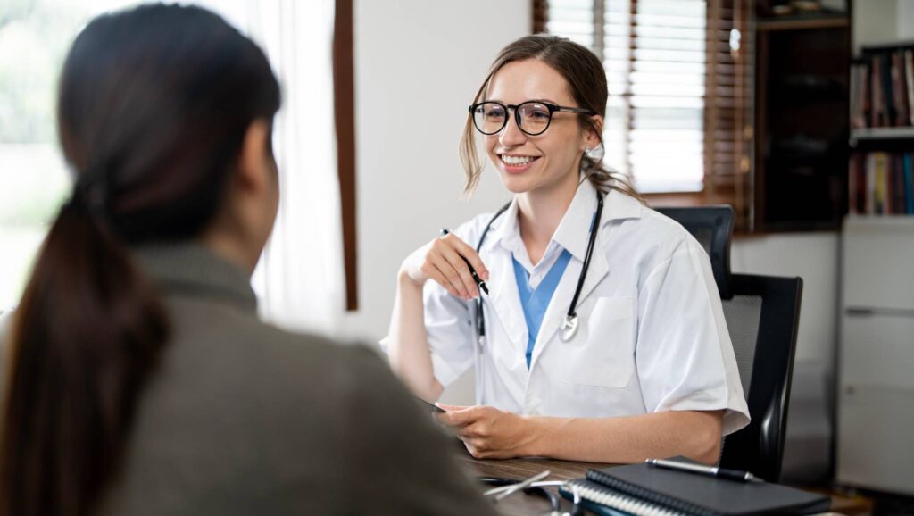 A supportive nurse speaking with a patient during detox - crack inpatient rehab program
