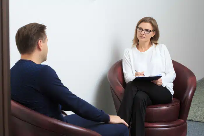 therapy session, showing a compassionate therapist and client - What types of addiction treatment programs are available? therapy session, showing a compassionate therapist and client - What types of addiction treatment programs are available?