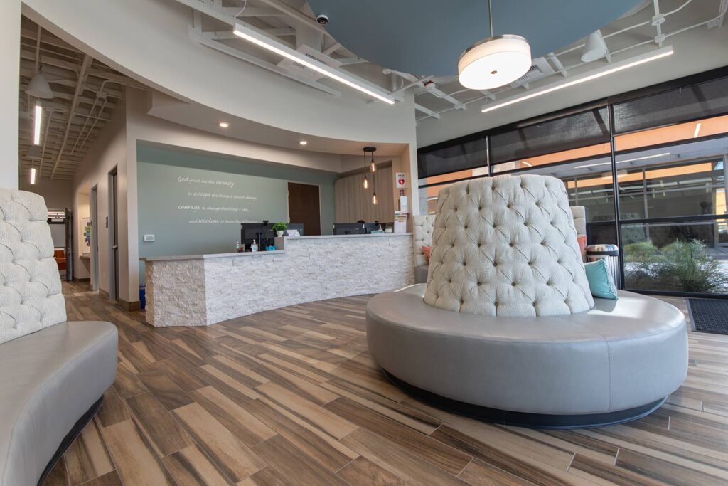 A comfortable and modern therapy room with chairs, plants, and natural light, suggesting a welcoming and supportive environment for treatment. - outpatient rehab programs in scottsdale A comfortable and modern therapy room with chairs, plants, and natural light, suggesting a welcoming and supportive environment for treatment. - outpatient rehab programs in scottsdale