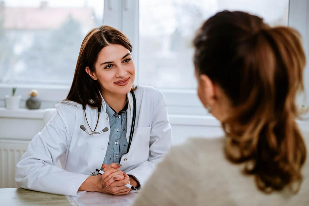 A compassionate nurse speaking with a patient in a comfortable, well-lit room - alcohol detox in Texas A compassionate nurse speaking with a patient in a comfortable, well-lit room - alcohol detox in Texas